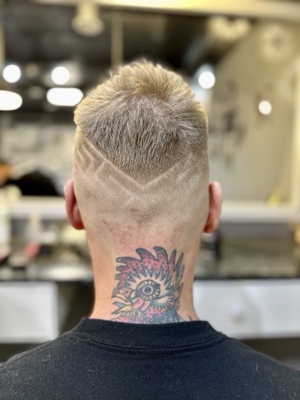 Detailed fade with a chevron design, viewed from the back