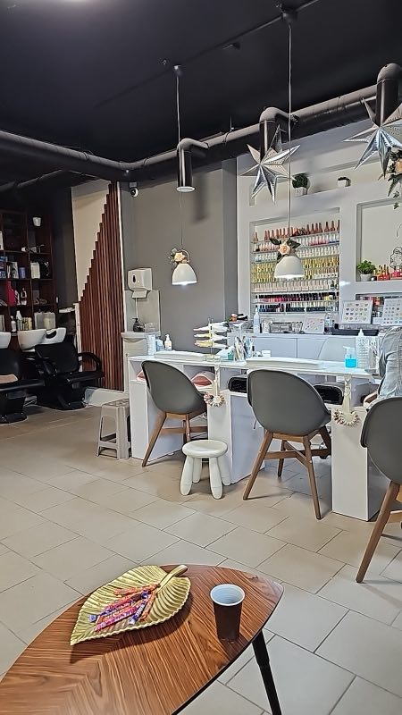 Inside the salon: nail stations, barber chairs and star decorations